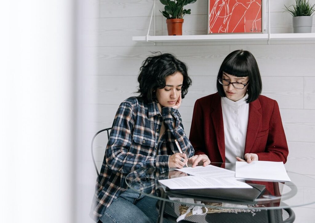 Same sex couple signing a cohabitation agreement