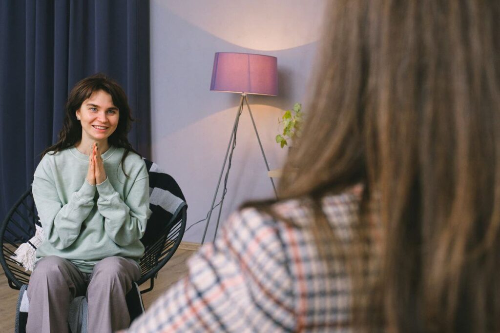 Woman in divorce coaching session looking grateful and planning her future